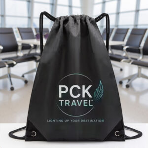 PCK Travel drawstring bag placed on airport seating with terminal background