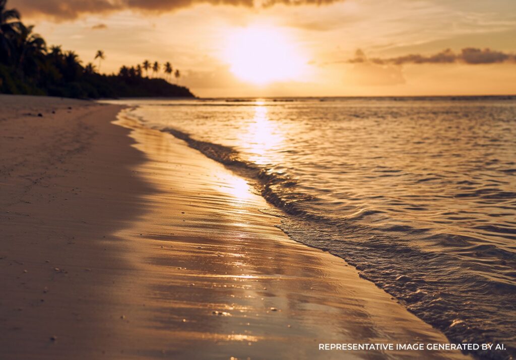 A golden sunset across the waves of a beach in Bora Bora.