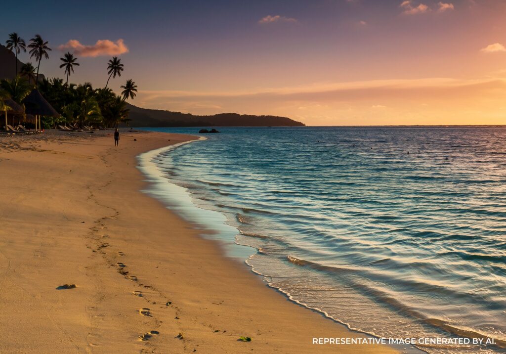 Soft pastel sunset casting warm light over a quiet Bora Bora shoreline.
