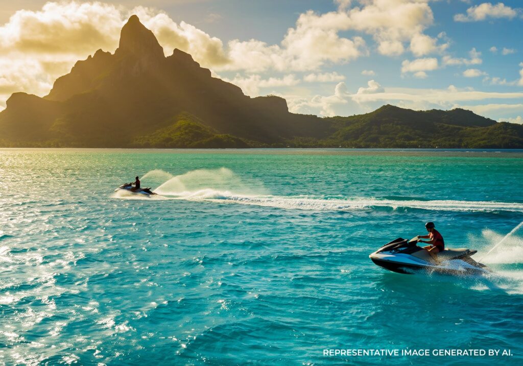 Jet skis riding across bright turquoise lagoon water in Bora Bora.