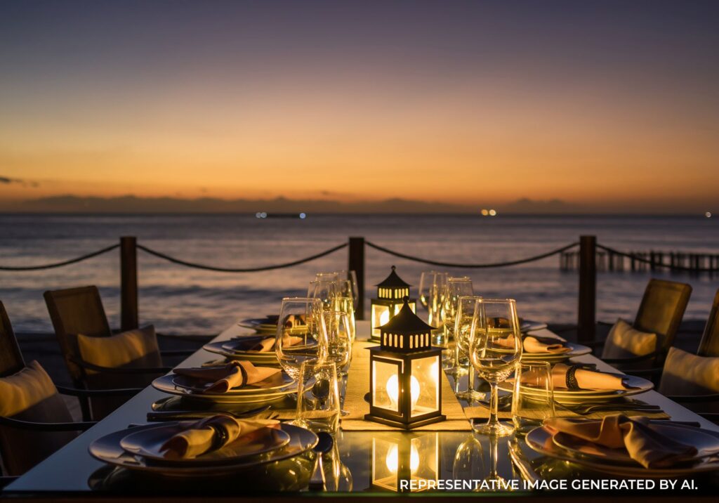 Romantic dinner table setup on a pier at sunset in Jamaica
