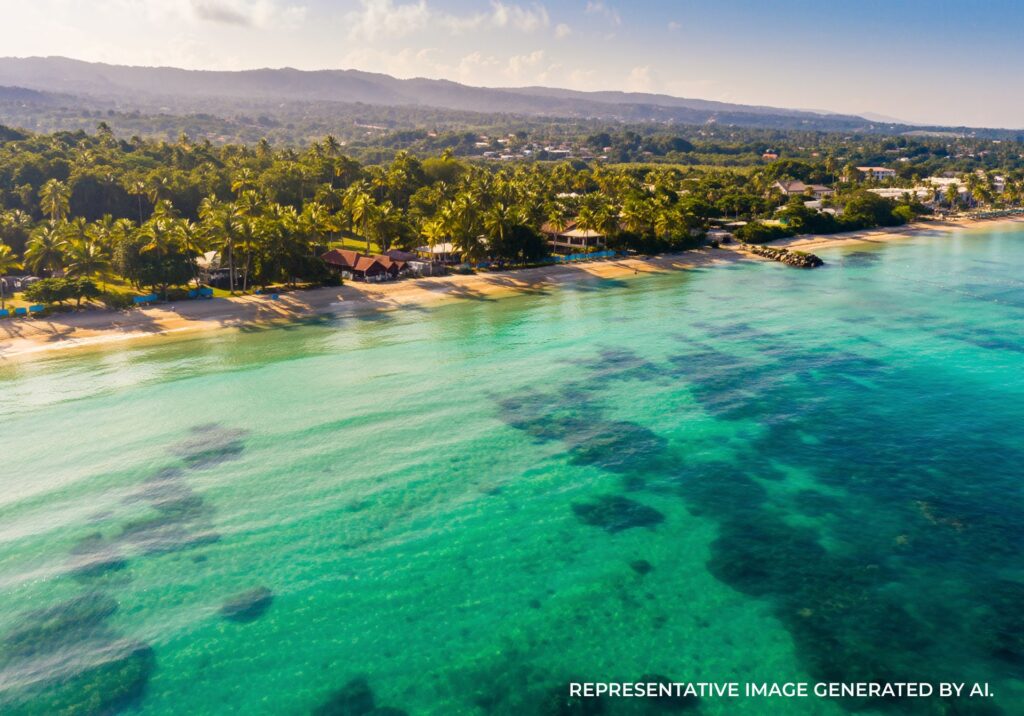 Aerial view of turquoise water and lush tropical coastline in Jamaica
