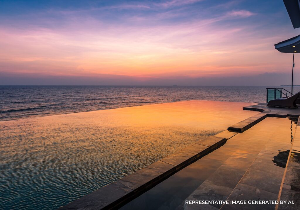 Sunset view from an infinity pool overlooking the calm ocean in the maldives