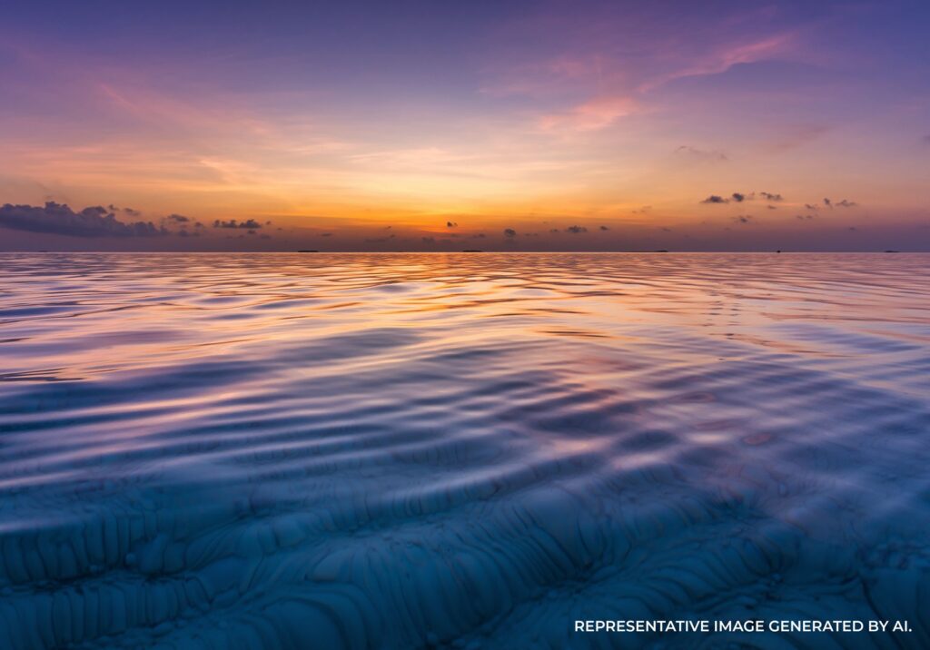 purple sunset reflecting on ocean waves with soft tropical colors in the maldives