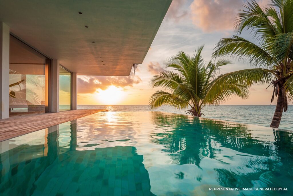 infinity pool at a luxury oceanfront villa at sunset with palm trees and ocean view in jamaica