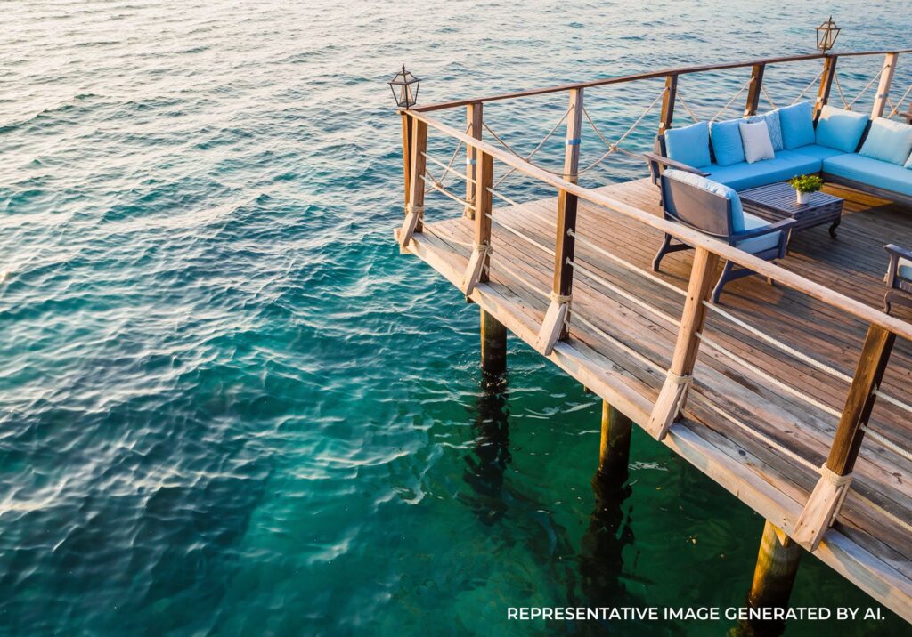 Wooden pier extending over turquoise water at a tropical destination in Jamaica