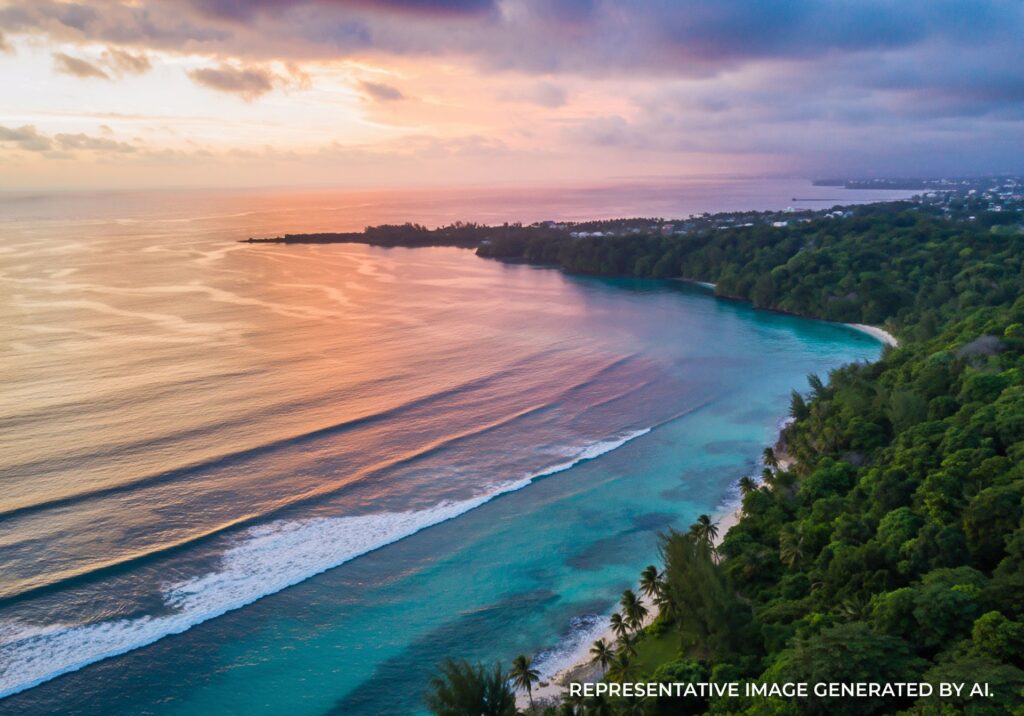 Sunset over turquoise water along a scenic coastline in Jamaica