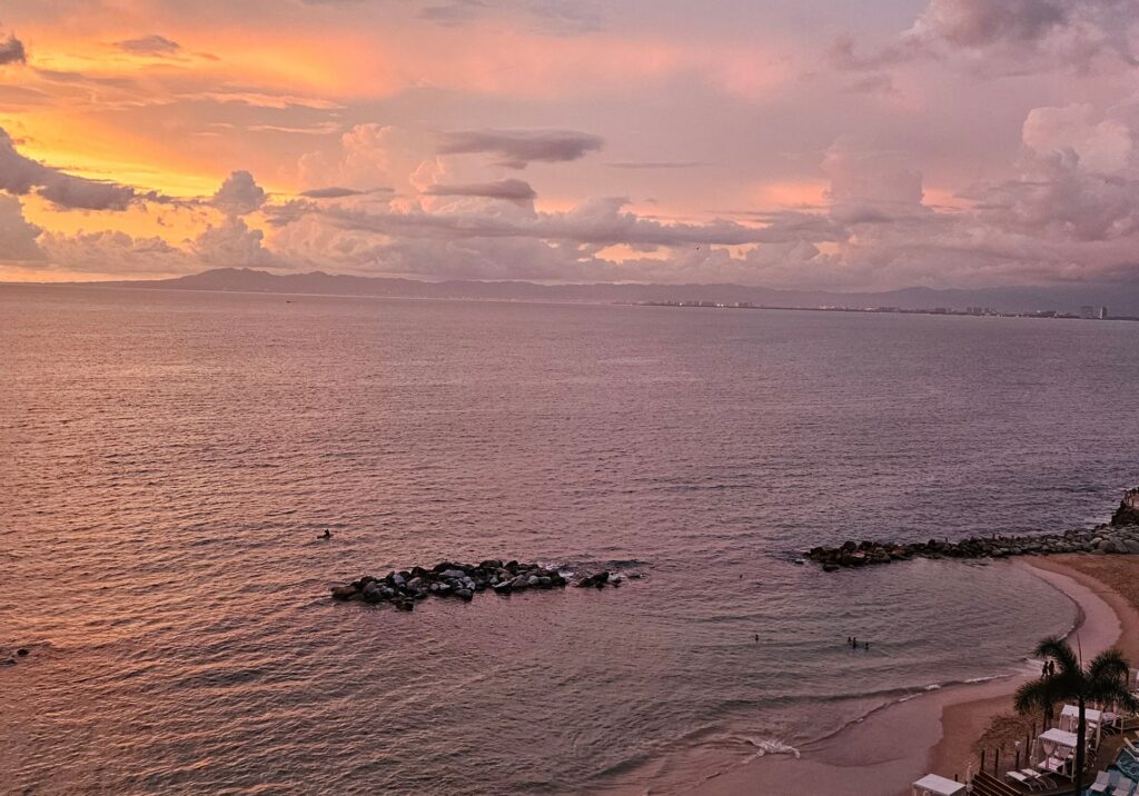 Pastel sunset reflecting over the calm Pacific waters in Puerto Vallarta