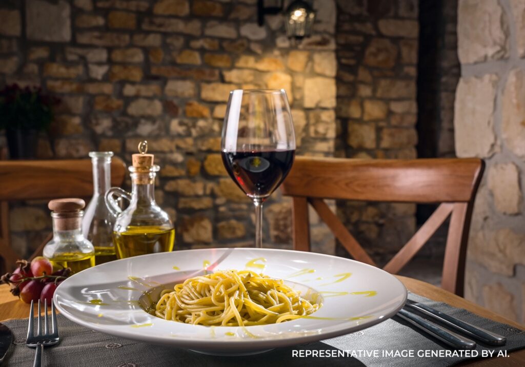 Wine and pasta at restaurant in Rome, Italy