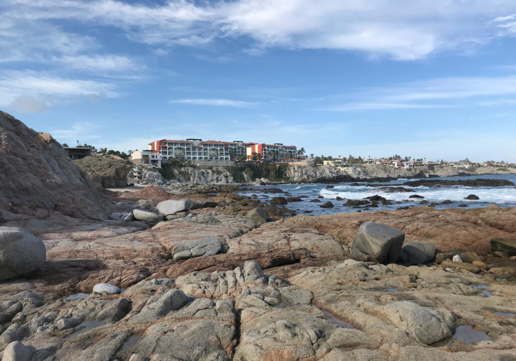 cky shoreline with shallow tidal pools along the Cabo San Lucas coast.