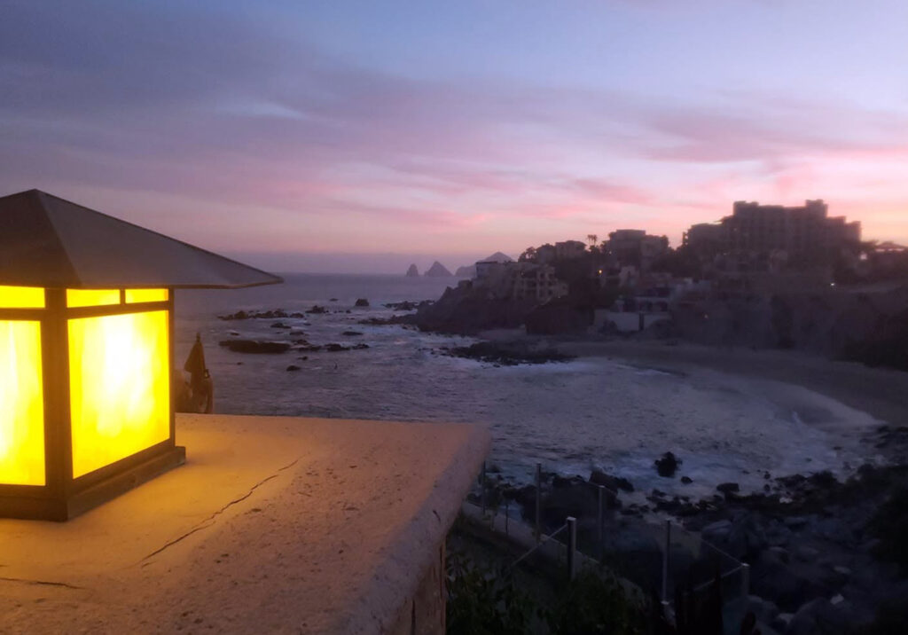 Coastal path overlooking the ocean during a colorful dusk sky in Cabo San Lucas.