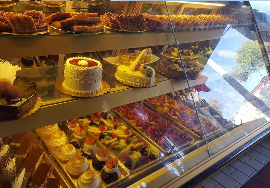 A deli case filled with desserts an in Laguna Beach,