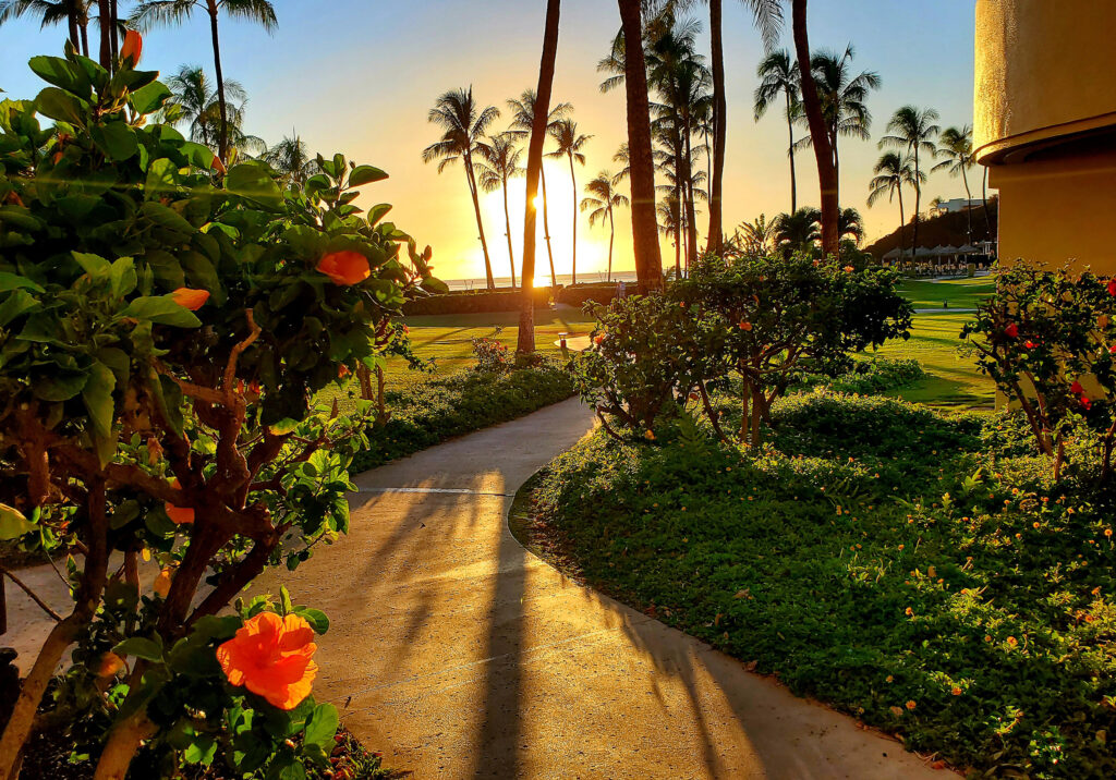 A luxury Maui beach resort at sunset garden view, part of the PCK Travel™ curated collection.