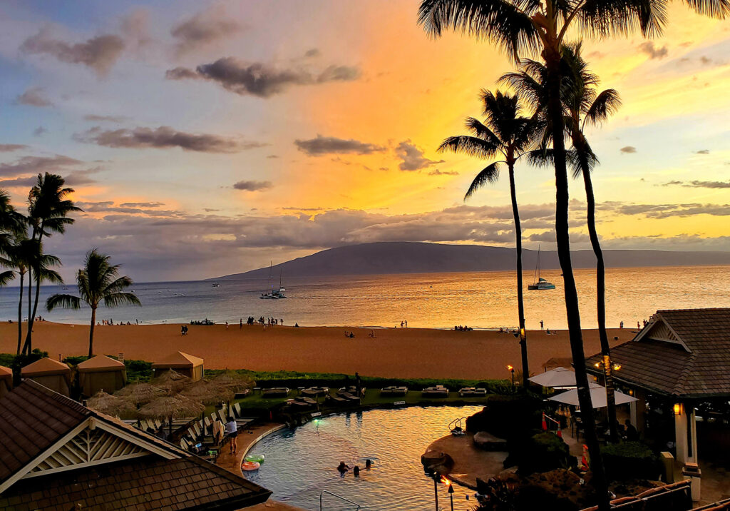 A luxury Maui beach resort at sunset, part of the PCK Travel™ curated collection.