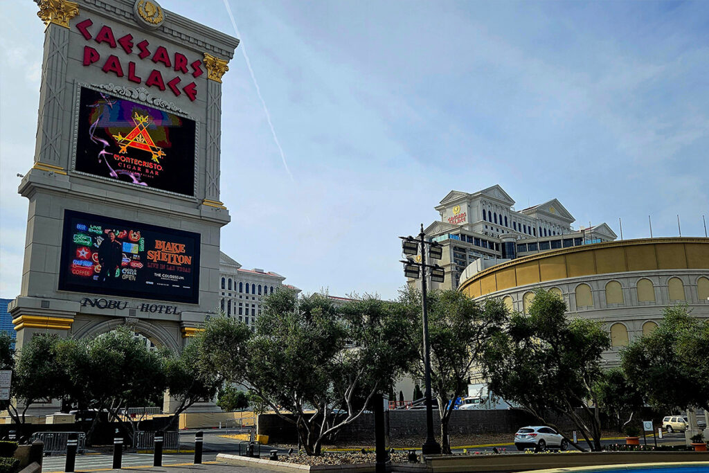 Caesars Palace exterior entrance with palm trees and Las Vegas Strip setting