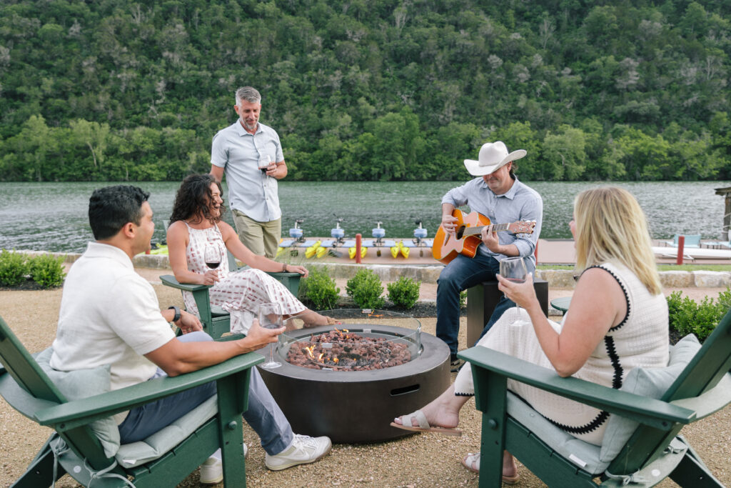Guests gathered around outdoor firepit at Lake Austin Spa Resort