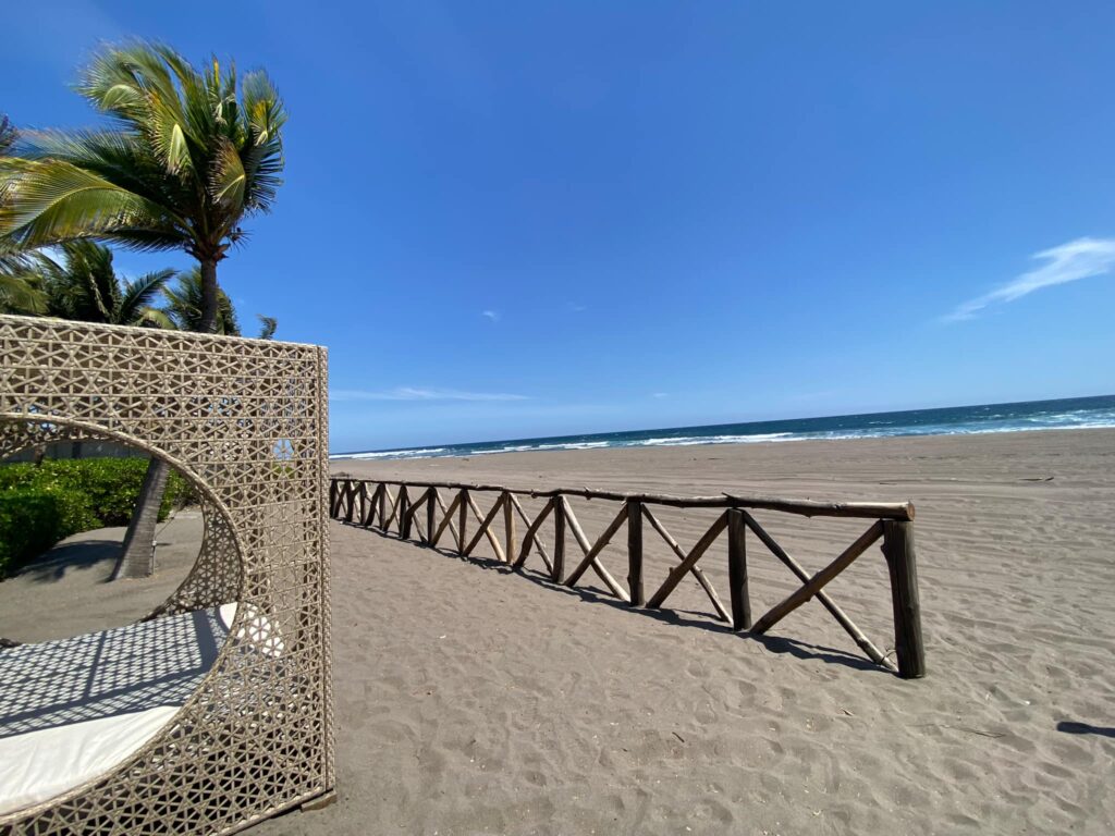Wooden walkway leading toward the coastline at a cruise port in El Salvador