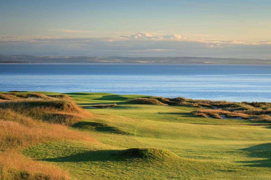 Castle Course Hole 18 at St. Andrews overlooking the North Sea with dramatic coastal fairways.