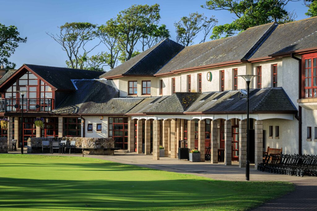 Eden Clubhouse at St. Andrews Links with traditional architecture and surrounding fairways.