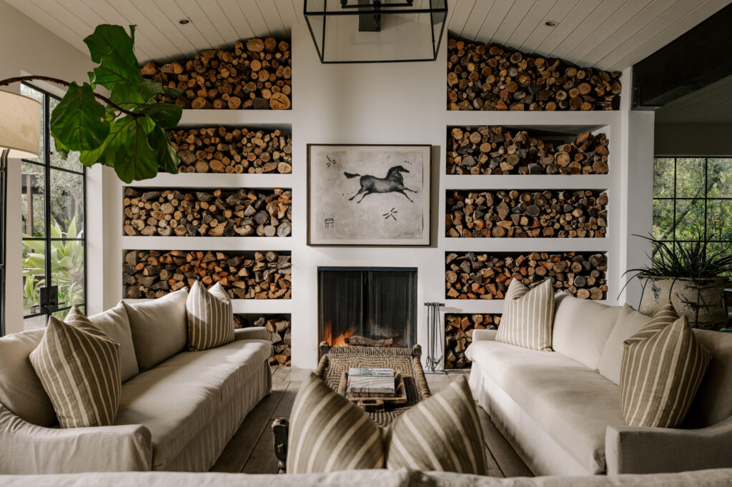 Cozy lounge with fireplace and wood accents at The Ranch retreat