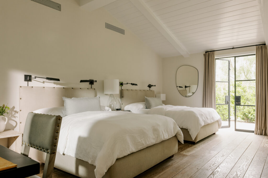 Minimalist bedroom with natural light at The Ranch wellness retreat