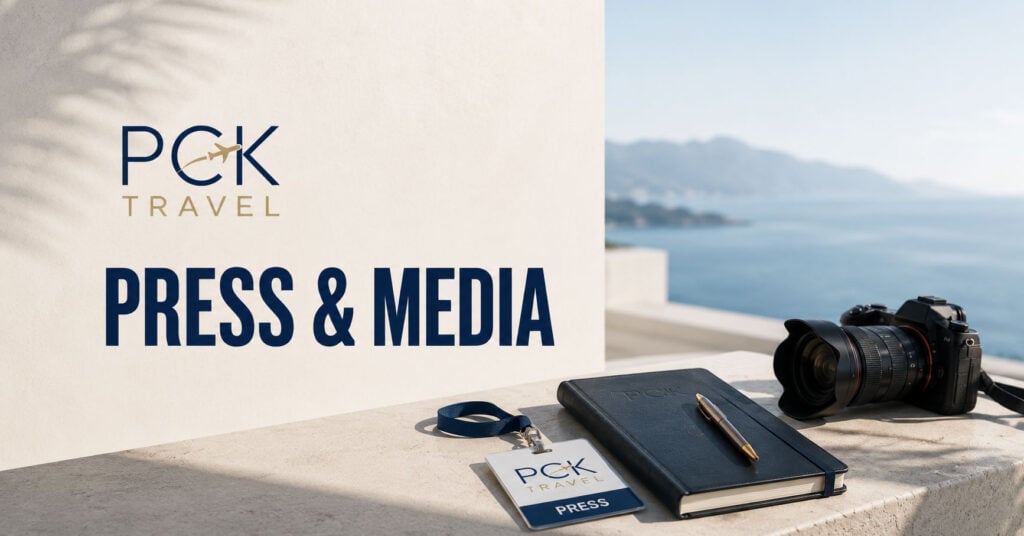 PCK Travel™ Press & Media promotional image featuring the PCK Travel logo, “Press & Media” headline, and a coastal ocean backdrop. A professional camera, press credential, notebook, and pen rest on a terrace table, representing travel journalism, storytelling, and media resources.