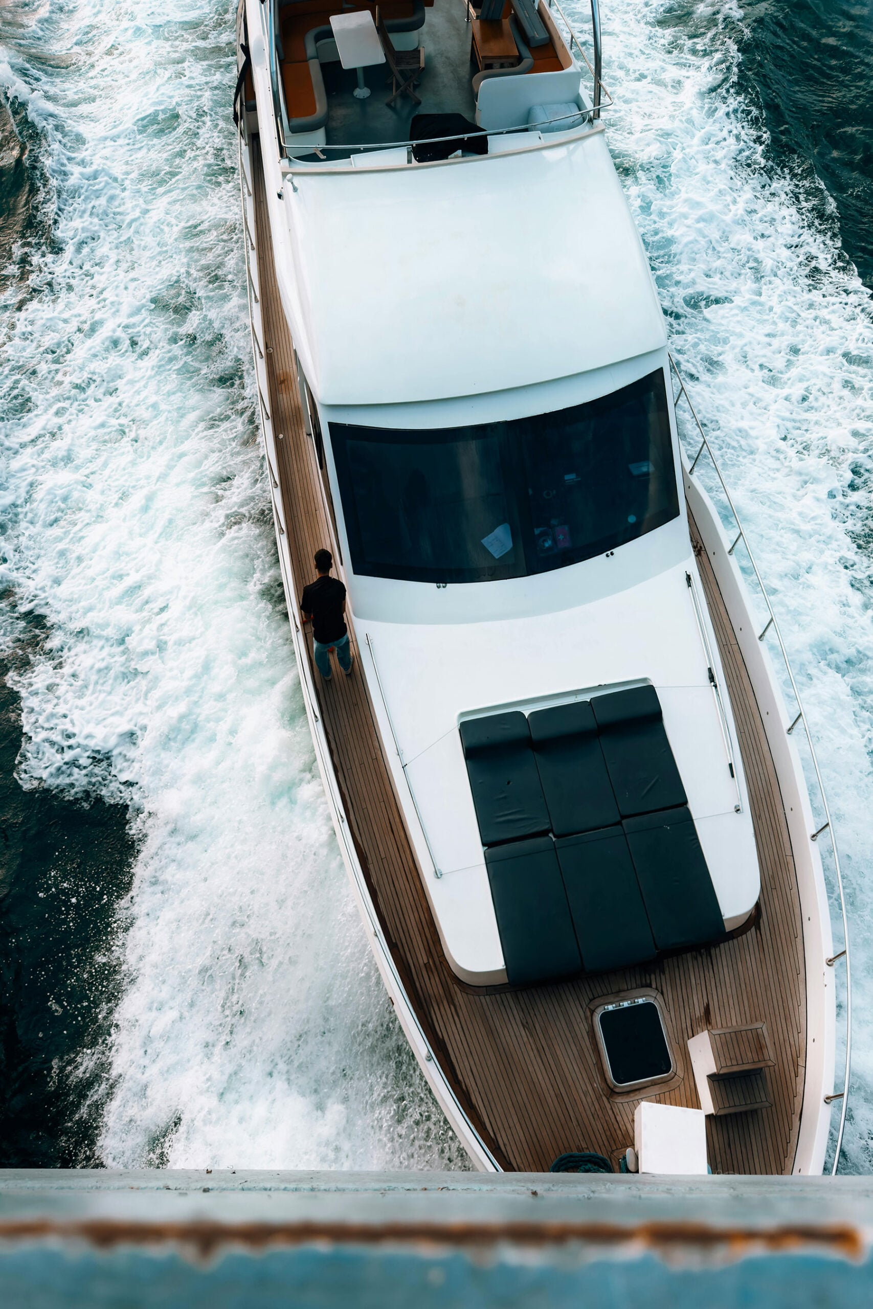 Aerial view of luxury yacht cruising through open water