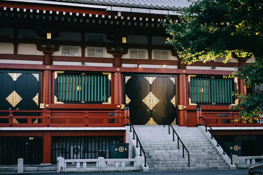 Traditional Japanese temple building with wooden architecture and decorative details in Tokyo.