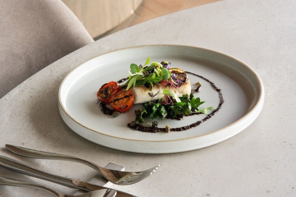 Beautifully plated modern Japanese entrée served in an elegant fine dining restaurant.