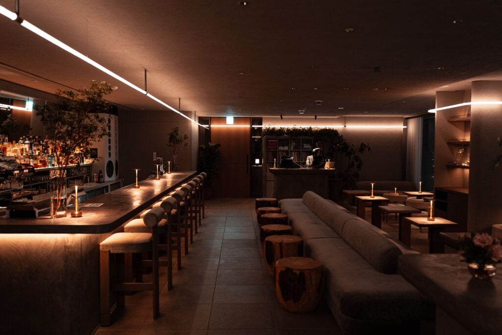 Elegant cocktail bar with warm lighting, stylish seating, and a sophisticated atmosphere in Tokyo.